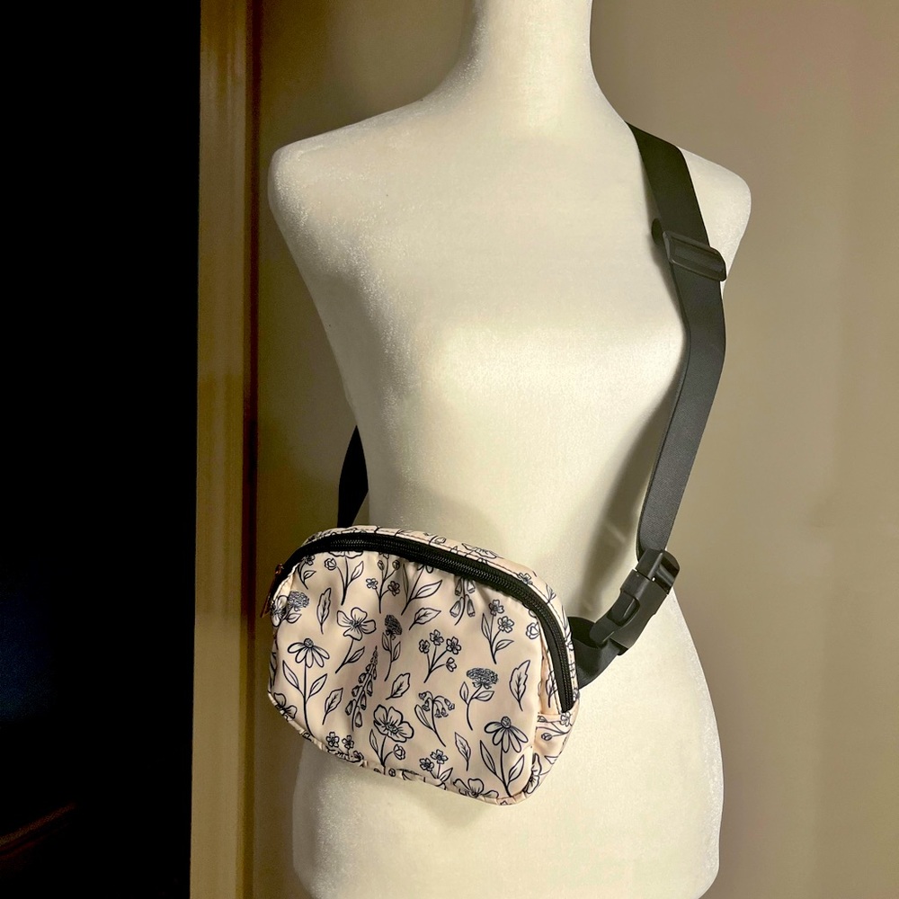 Adorable cross body or hip bag with cute floral design.